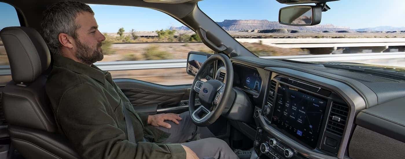 A person driving in a 2025 Ford F-150.