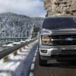 2025 Ford F-150 driving up maintain road head on.