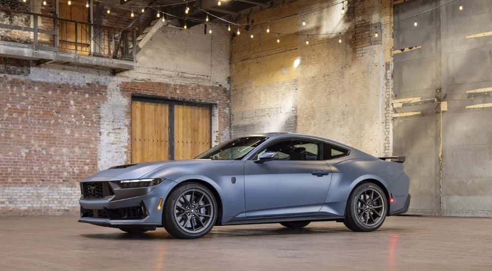 Blue 2024 Ford Mustang Dark Horse from the side.