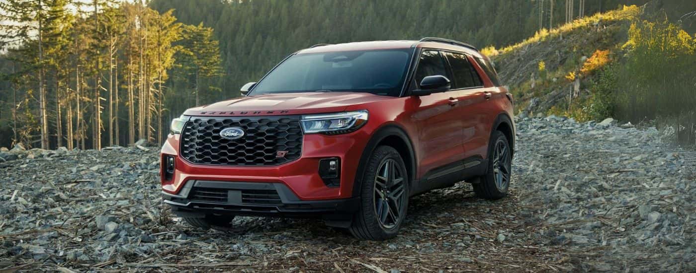 A red 2025 Ford Explorer parked off-road