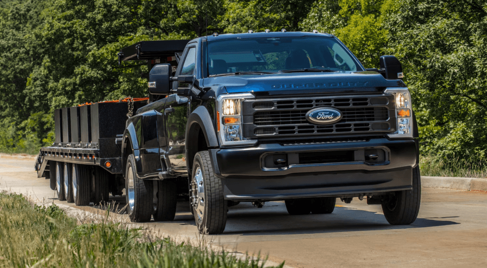Black 2026 Ford Super Duty towing a trailer