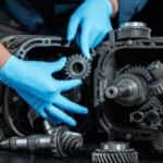 A technician performing a transmission repair near Snellville.