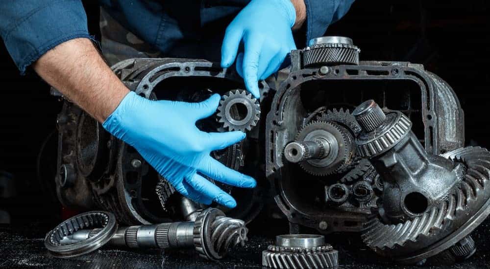 A technician performing a transmission repair near Snellville.