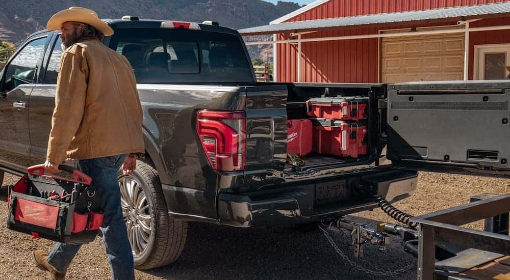 The truck bed of a 2026 Ford F-150 holding tools