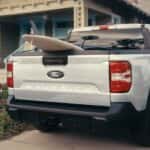 A white 2026 Ford Maverick parked in a driveway.