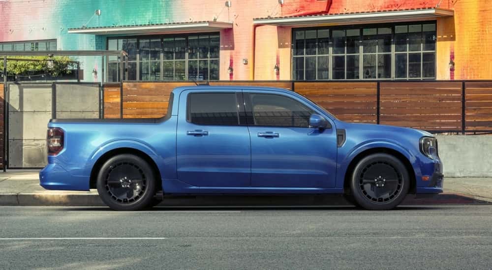A blue 2025 Ford Maverick Lobo parked in a city