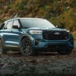 A blue 2026 Ford Explorer ST parked off-road