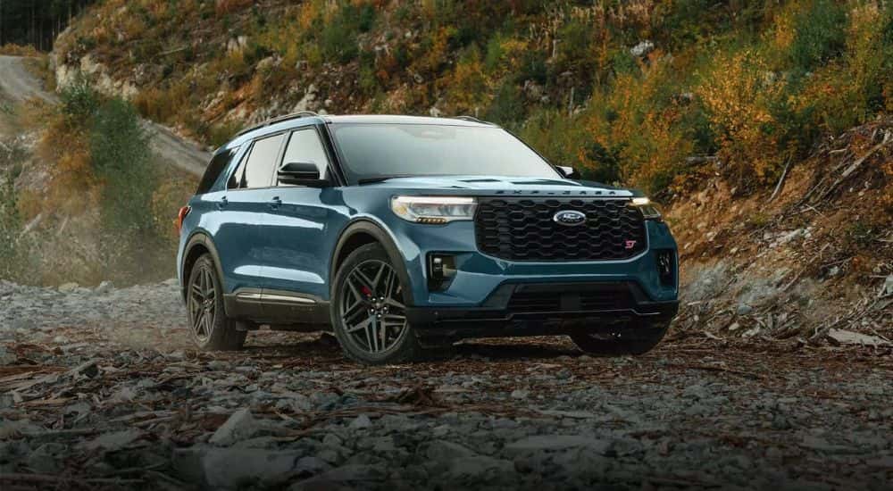 A blue 2026 Ford Explorer ST parked off-road
