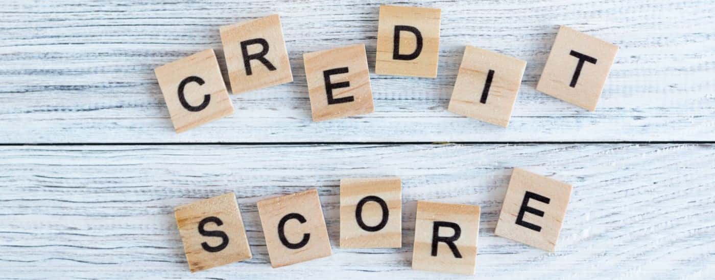 A collection of bricks spelling out the words "credit score."