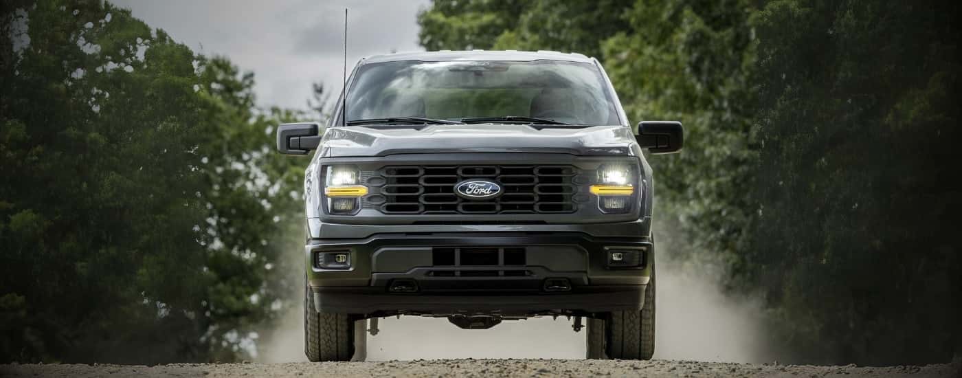 Black 2026 Ford F-150 driving head on