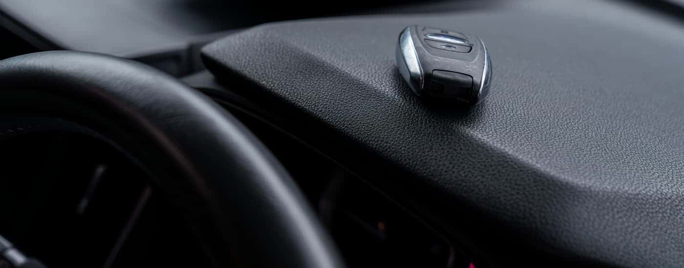 Car key on a dashboard in a vehicle