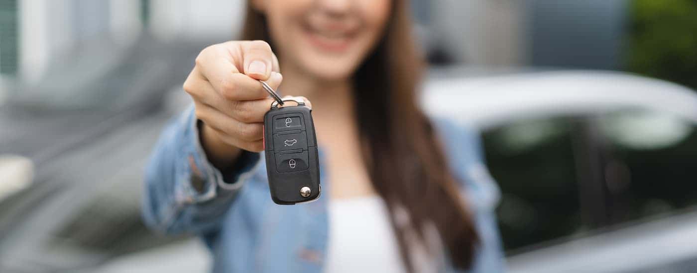 Woman holding a car key