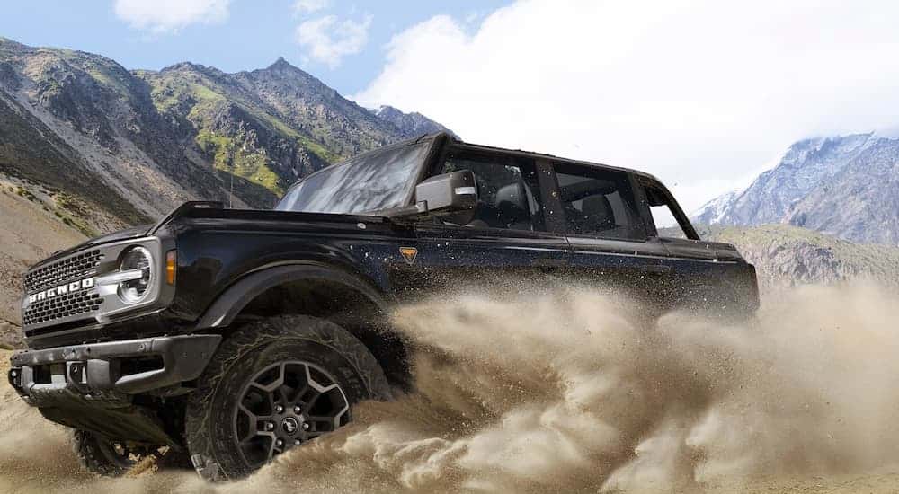 A black 2026 Ford Bronco off-roading in sand