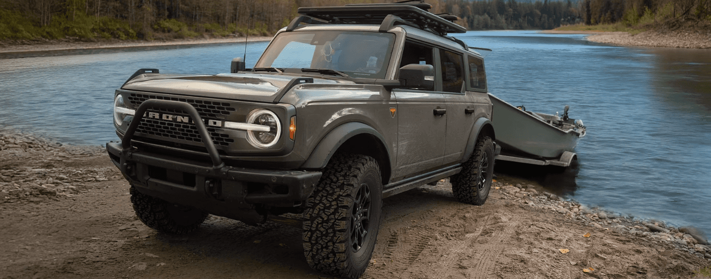 Green 2026 Ford Bronco pulling a boat out of water