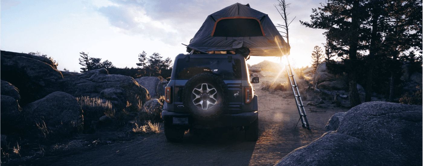 Blue 2026 Ford Bronco with a rooftop tent