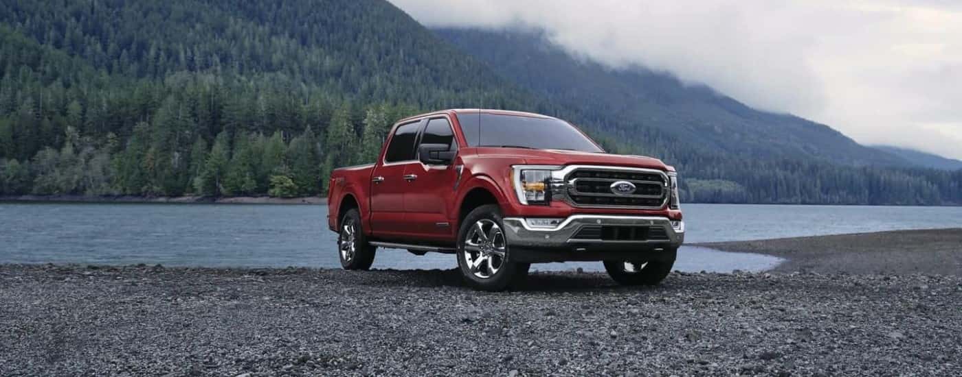2023 Red Ford F-150 parked near a lake