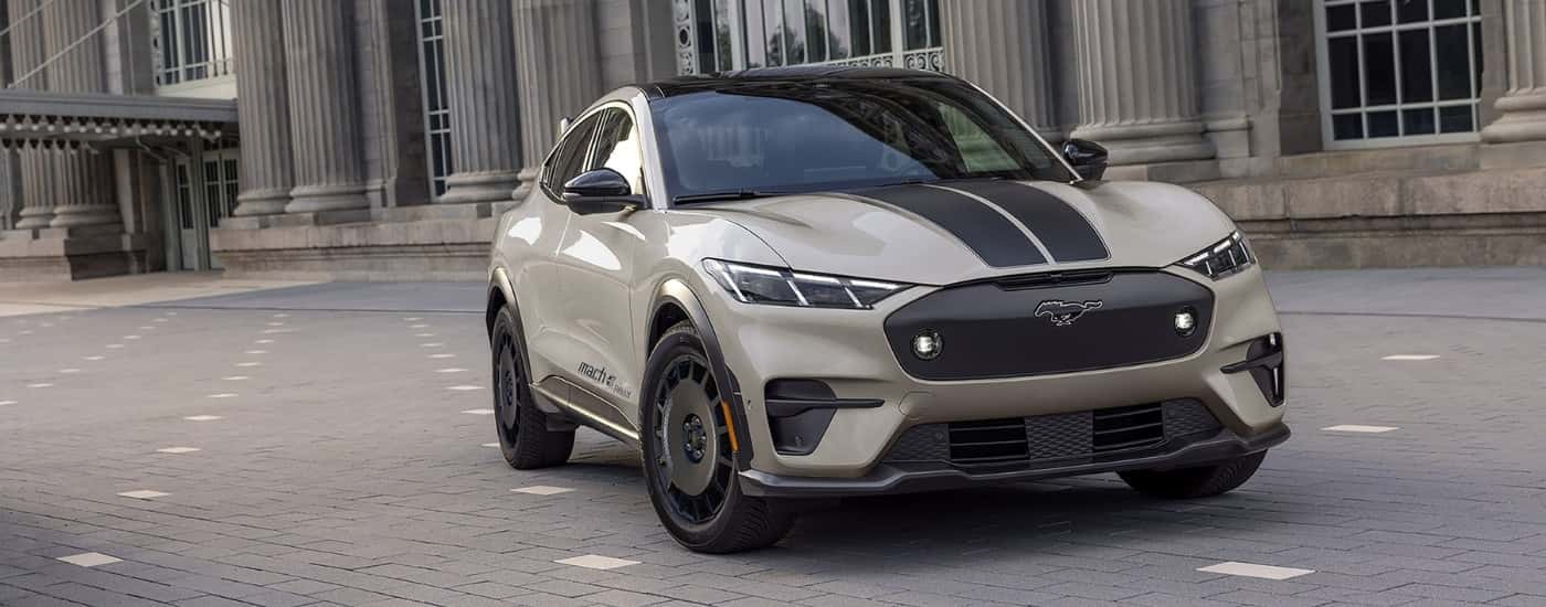 Beige and black 2025 Ford Mustang Mach-E Rally parked at an angle