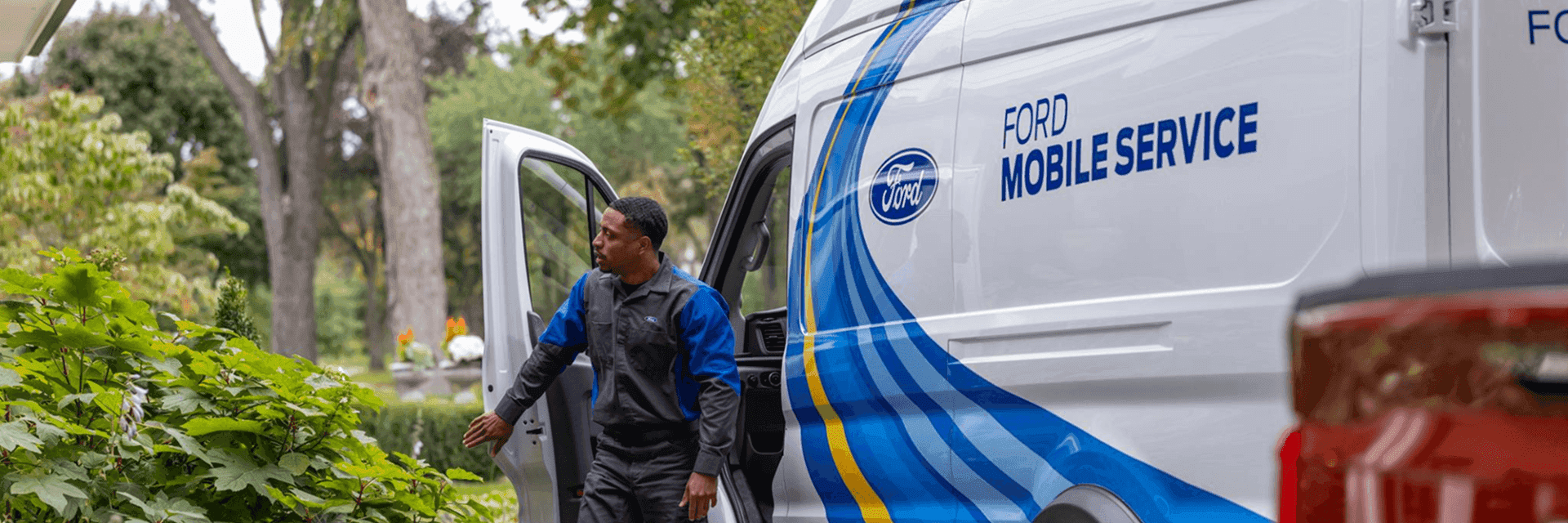 ford technician in front of mobile service van