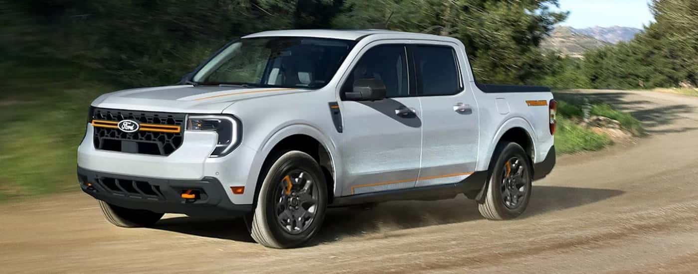 White 2026 Ford Maverick Tremor driving down an open road