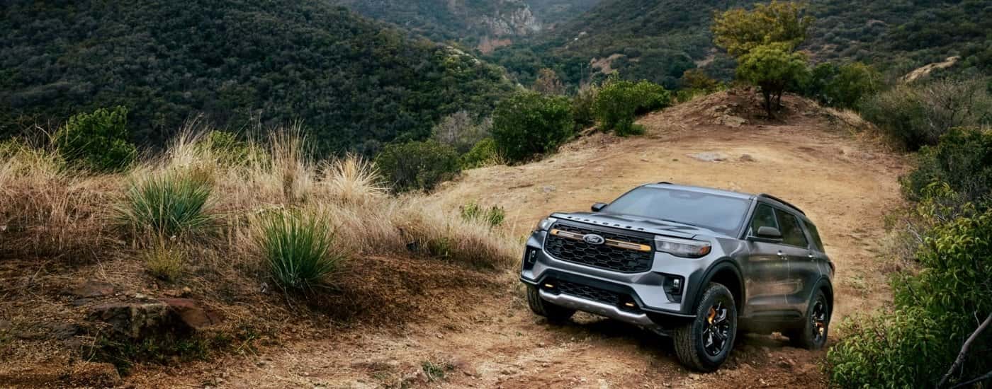 Grey 2026 Ford Explorer Tremor driving on a trail