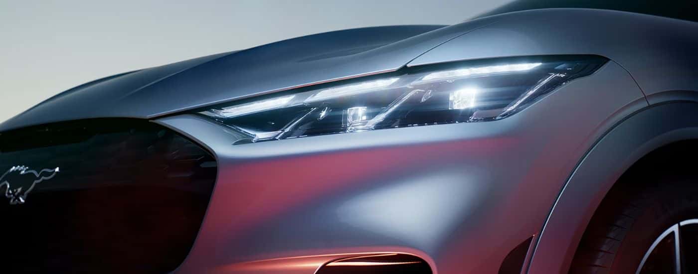 Close up on the headlight of a silver 2026 Ford Mustang Mach-E.