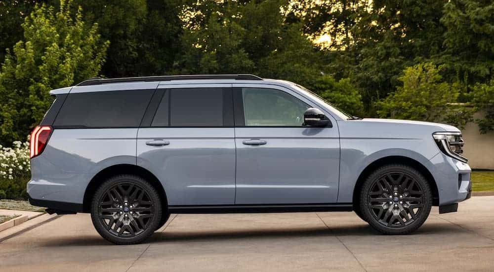 A blue 2027 Ford Expedition parked on a driveway.