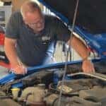 Ford repair technician servicing a vehicle