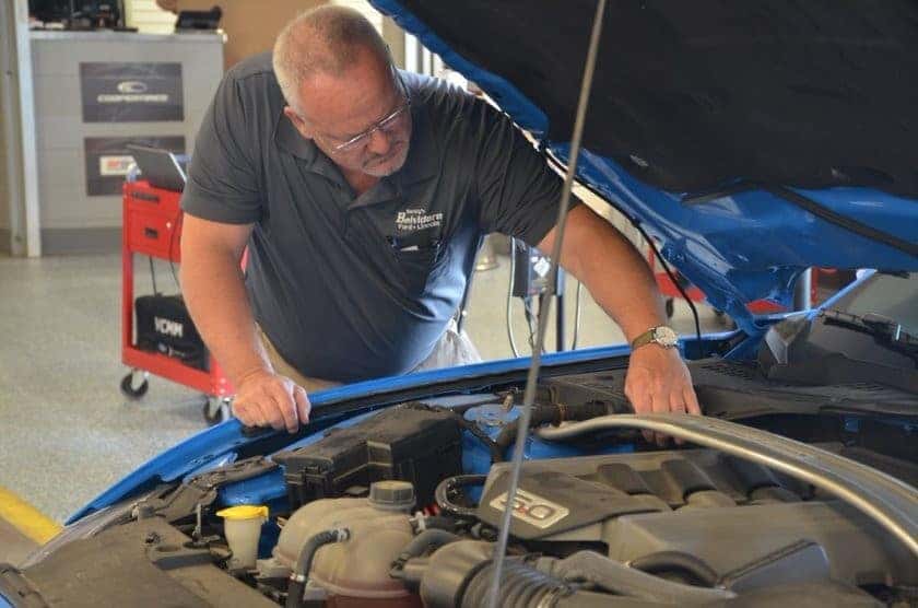 Ford repair technician servicing a vehicle