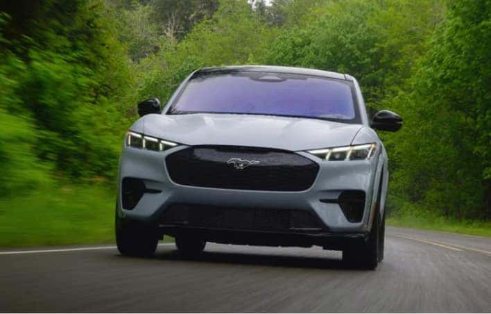Blue Ford SUV driving on the highway