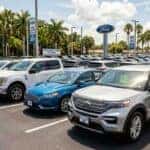Wide view of the new and used vehicle inventory at Mullinax Ford of Kissimmee, featuring Ford trucks, SUVs, and cars with Up Front® Pricing and no dealer fees.