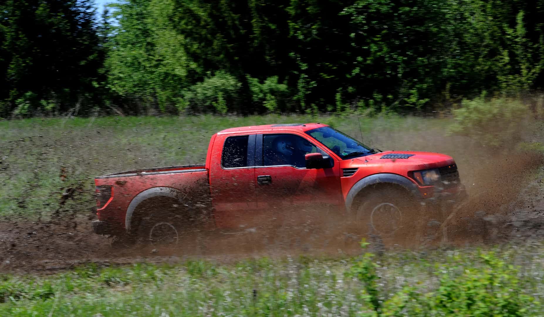 The 2010 F-150 SVT Raptor, equipped with the optional all-new 6.2-liter engine, getting dirty in it's natural environment.