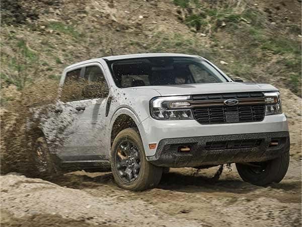 Ford Blue Bronco on top of some rocks