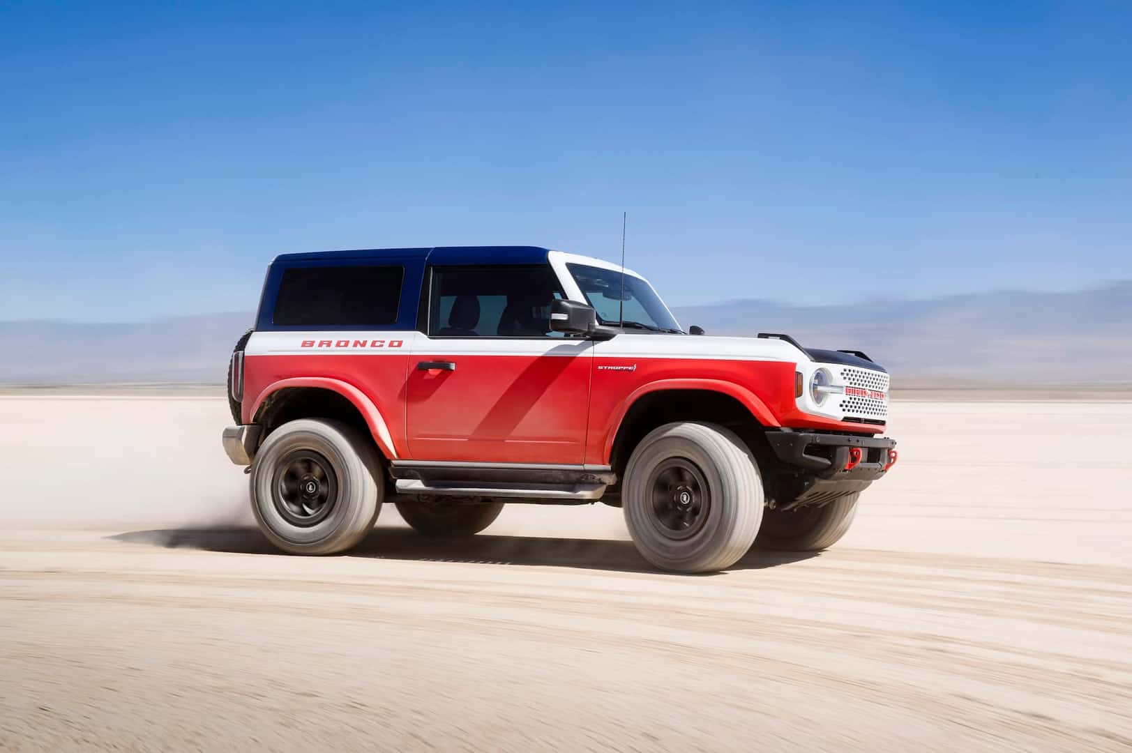 passenger side view of the 2025 bronco stroppe special edition on a canyon road