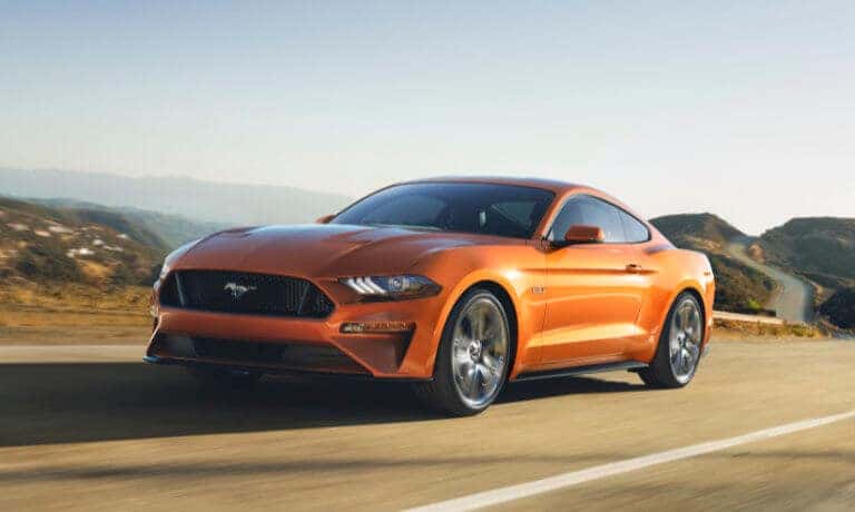 2022 Ford Mustang driving in the hills