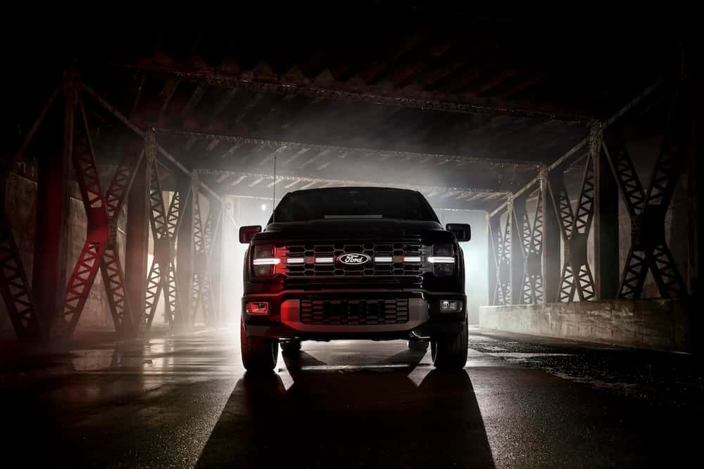 Front-end shot of illuminated grill of 2025 Ford F150 Lobo -Available Fall 2025.