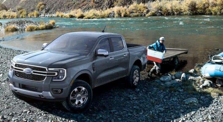 A gray 2024 Ford Ranger parked near a river.