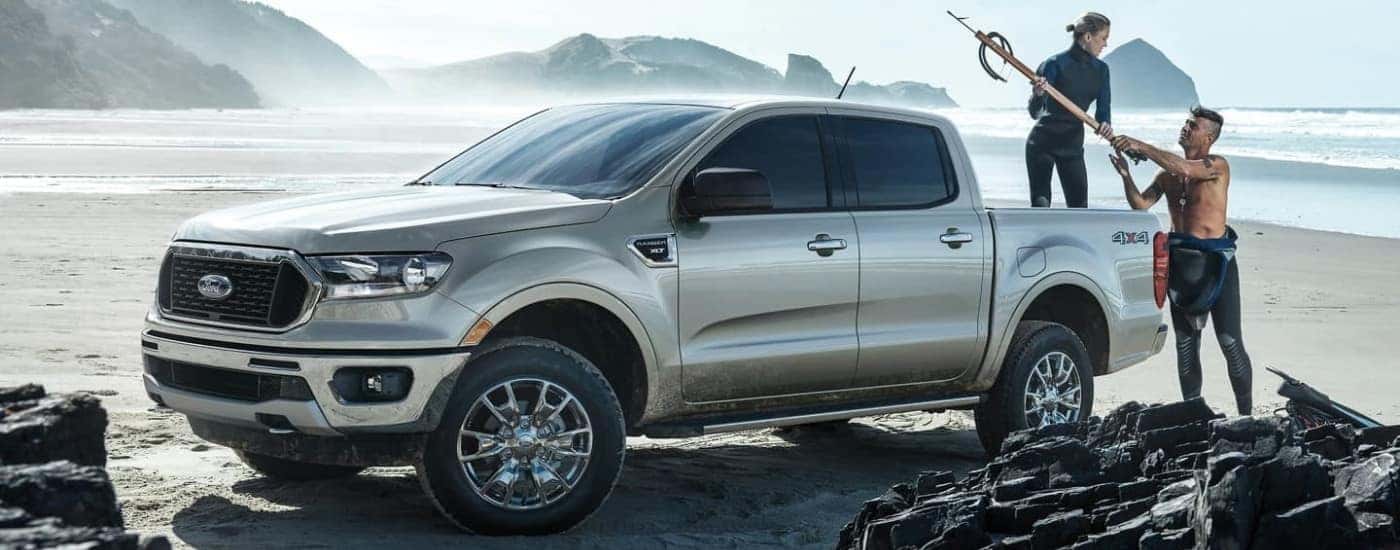 A silver 2023 Ford Ranger XLT parked on a shoreline.