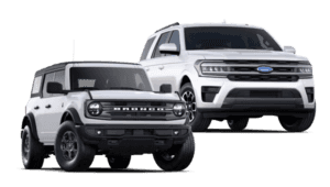 A white 2024 Ford Bronco and a white 2024 Ford Expedition side by side.