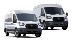 Two white Ford vans side by side.