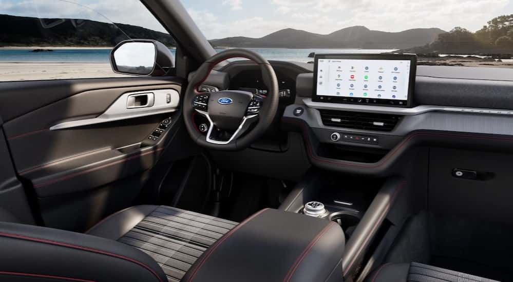 The black interior and dash in a 2025 Ford Explorer for sale.