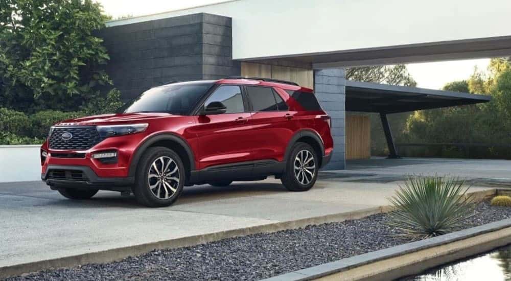 A red 2023 Ford Explorer ST parked on a driveway.