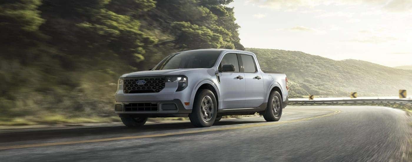 A grey 2025 Ford Maverick for sale in Hendersonville is rounding a corner.