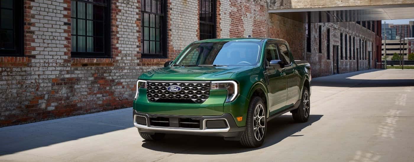A green 2025 Ford Maverick is shown from the front at an angle.