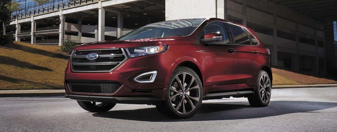 A maroon 2018 Ford Edge parked after looking at a used Ford for sale near you.