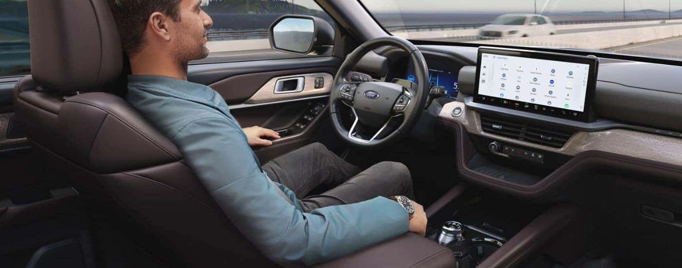Man sitting in the driver seat of a 2025 Ford Explorer