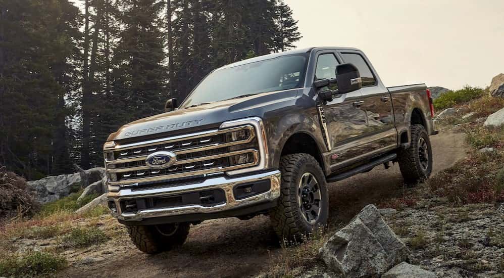 A gray 2025 Ford F-250 off-roading downhill.