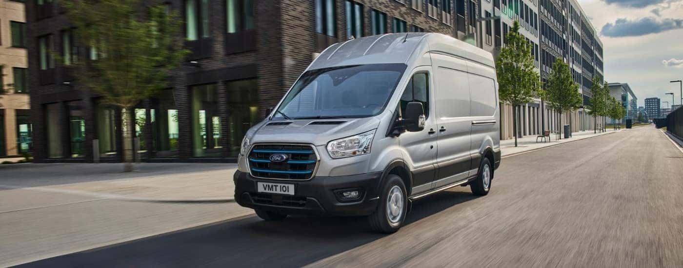 A silver 2025 Ford Transit from the front at an angle.