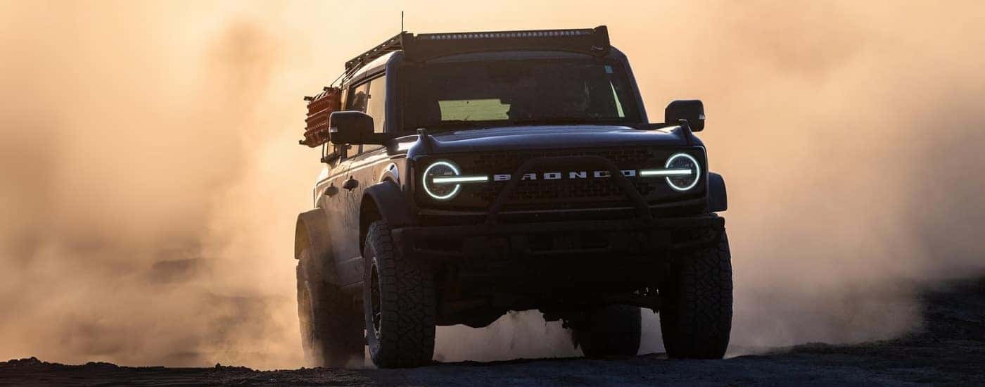 A grey 2025 Ford Bronco driving through mist.