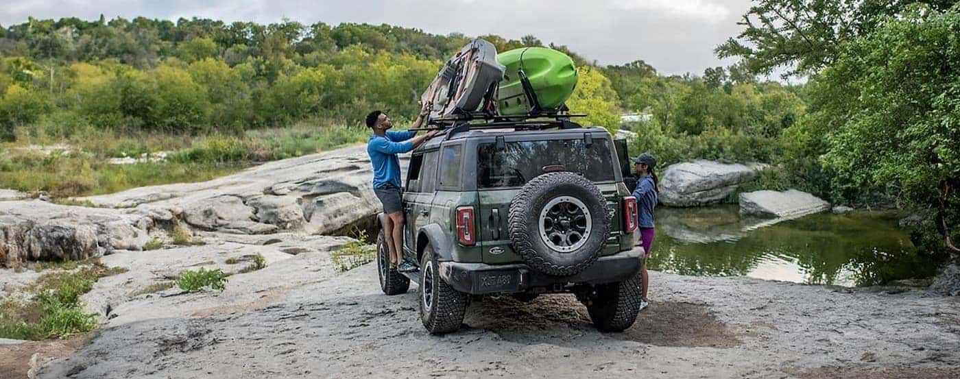 A green 2025 Ford Bronco parked off-road.