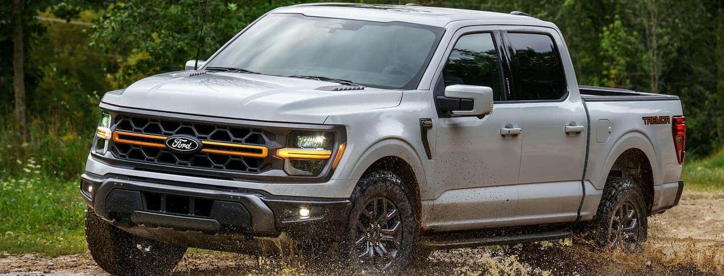 A silver 2025 Ford F-150 off-roading for sale near Candler